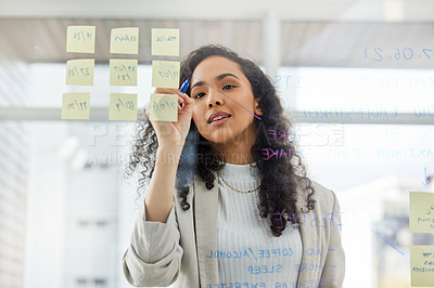 Buy stock photo Woman, writing and notes on glass wall for business planning, research and innovation in office. Female person, brainstorming and ideas on transparent board for solution, scrum and target or kpi