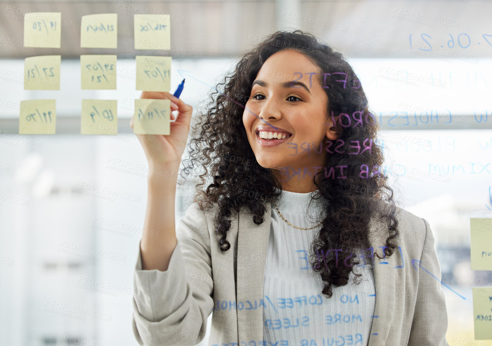 Buy stock photo Woman, smile and writing in office with marker for brainstorming, ideas and planning for company. Female person, sticky notes and boardroom on glass with happy as administrator for business or job