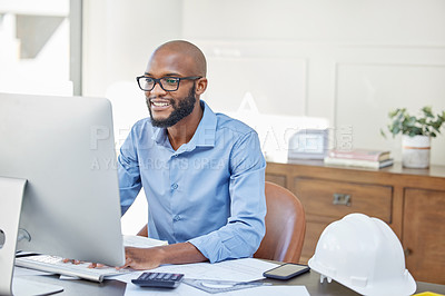 Buy stock photo Shot of a businessman using his computer while sitting at his desk