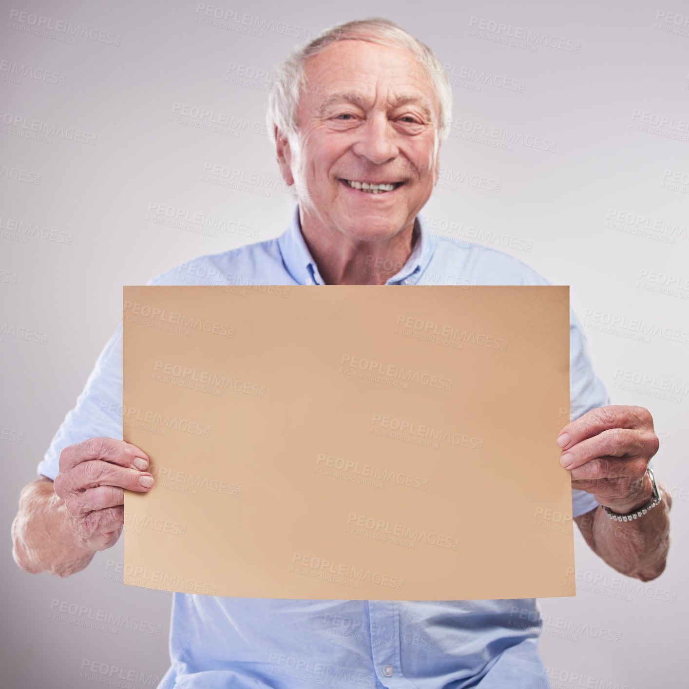 Buy stock photo Senior, man and portrait with poster in studio with happiness for sale announcement, promo and advertising with mockup. Elderly person, billboard and isolated on blue background for branding.