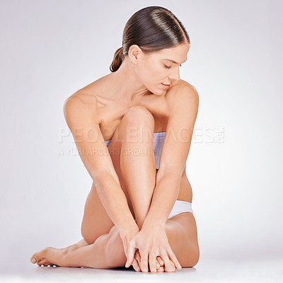 Buy stock photo Hair removal, skincare and woman with underwear in studio for natural cosmetic, epilation or grooming on white background. Body, legs and model on floor for beauty treatment, wellness or satisfaction