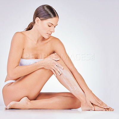 Buy stock photo Hair removal, skincare and woman with shaving cream in studio for natural cosmetic, epilation or grooming. Body, legs and model on floor for treatment, wellness or satisfaction on white background. 