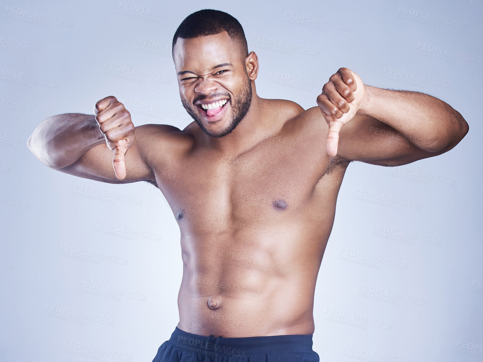 Buy stock photo Body, portrait or fitness man with thumbs down in studio with rating, hate and dislike gesture on grey background. No, face and sports model with emoji vote, stop and feedback, review and opinion
