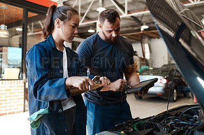 Buy stock photo Employees, car mechanic and garage with tablet or clipboard for inspection, teamwork and collaboration. People, checklist and vehicle repairs or service as engineer with small business and workshop