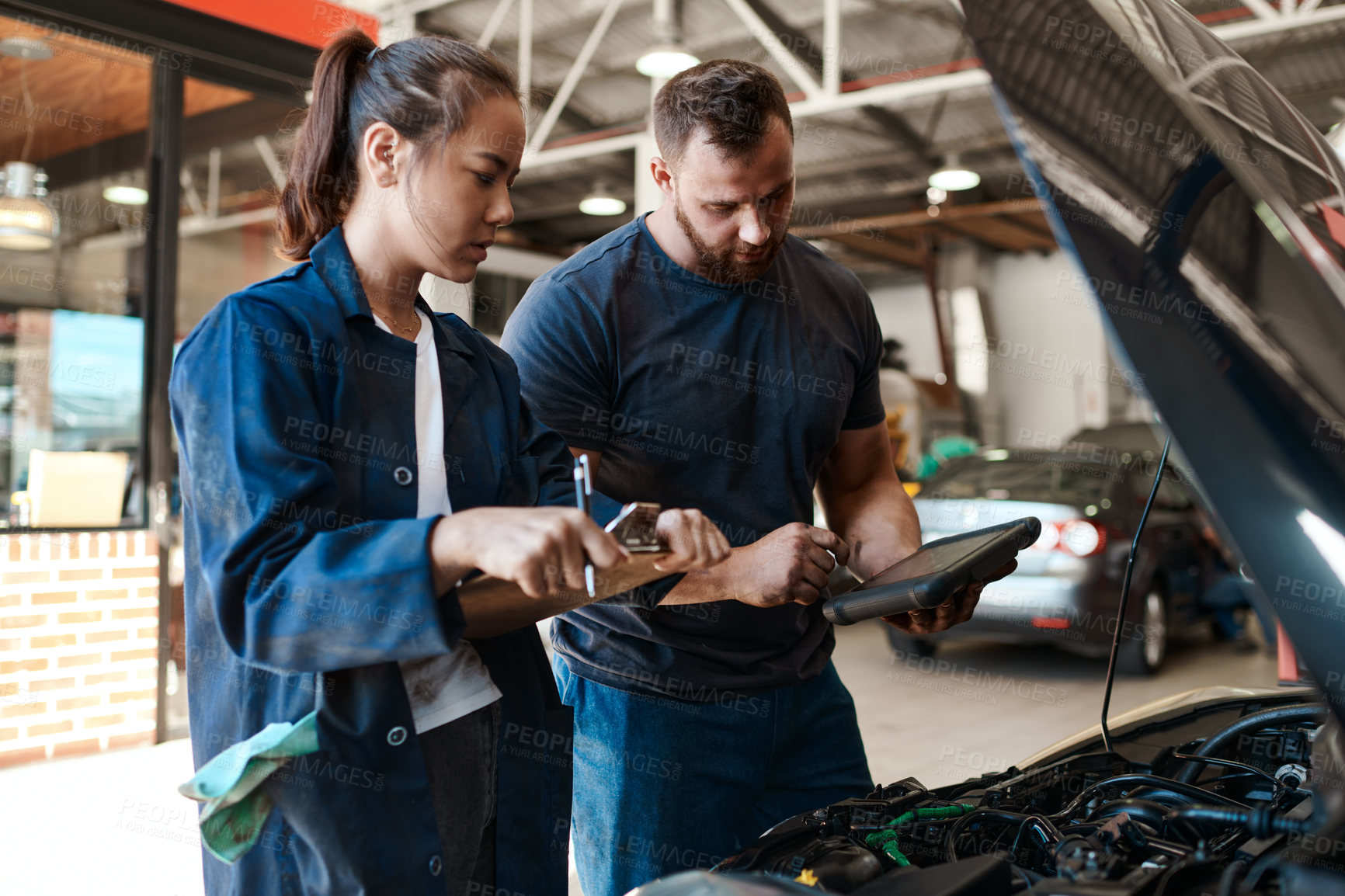 Buy stock photo Employees, car mechanic and garage with tablet or clipboard for inspection, teamwork and collaboration. People, checklist and vehicle repairs or service as engineer with small business and workshop