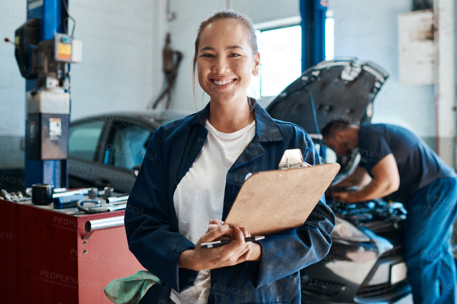 Buy stock photo Woman, portrait and clipboard by car for mechanic maintenance, services and safety check at workshop. Asian engineer or worker with checklist, document and inspection at auto shop or transport repair