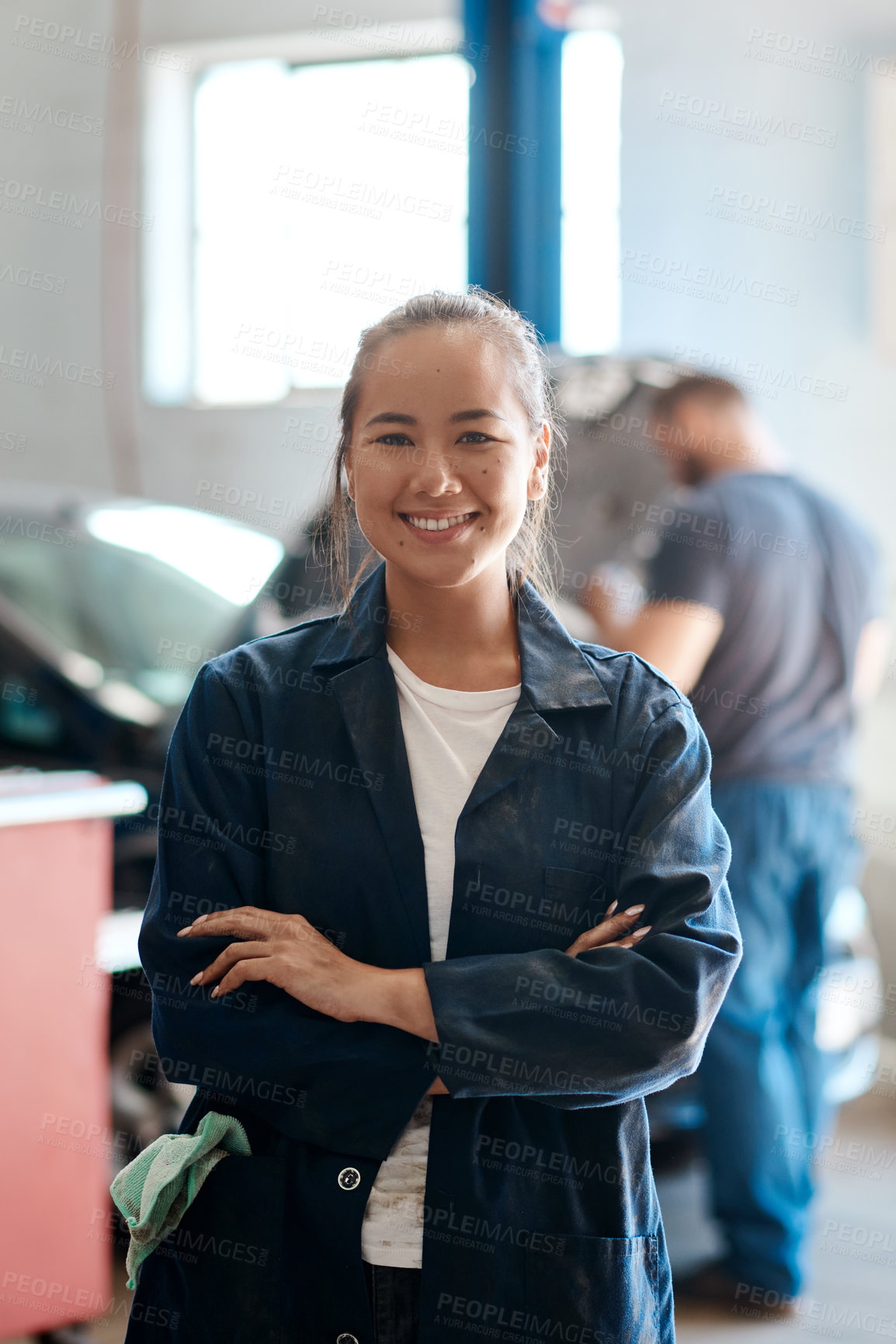 Buy stock photo Portrait, mechanic or woman with arms crossed in garage, skills or service with small business. Face, equality or entrepreneur in auto repair shop, industry or opportunity with startup or fix vehicle