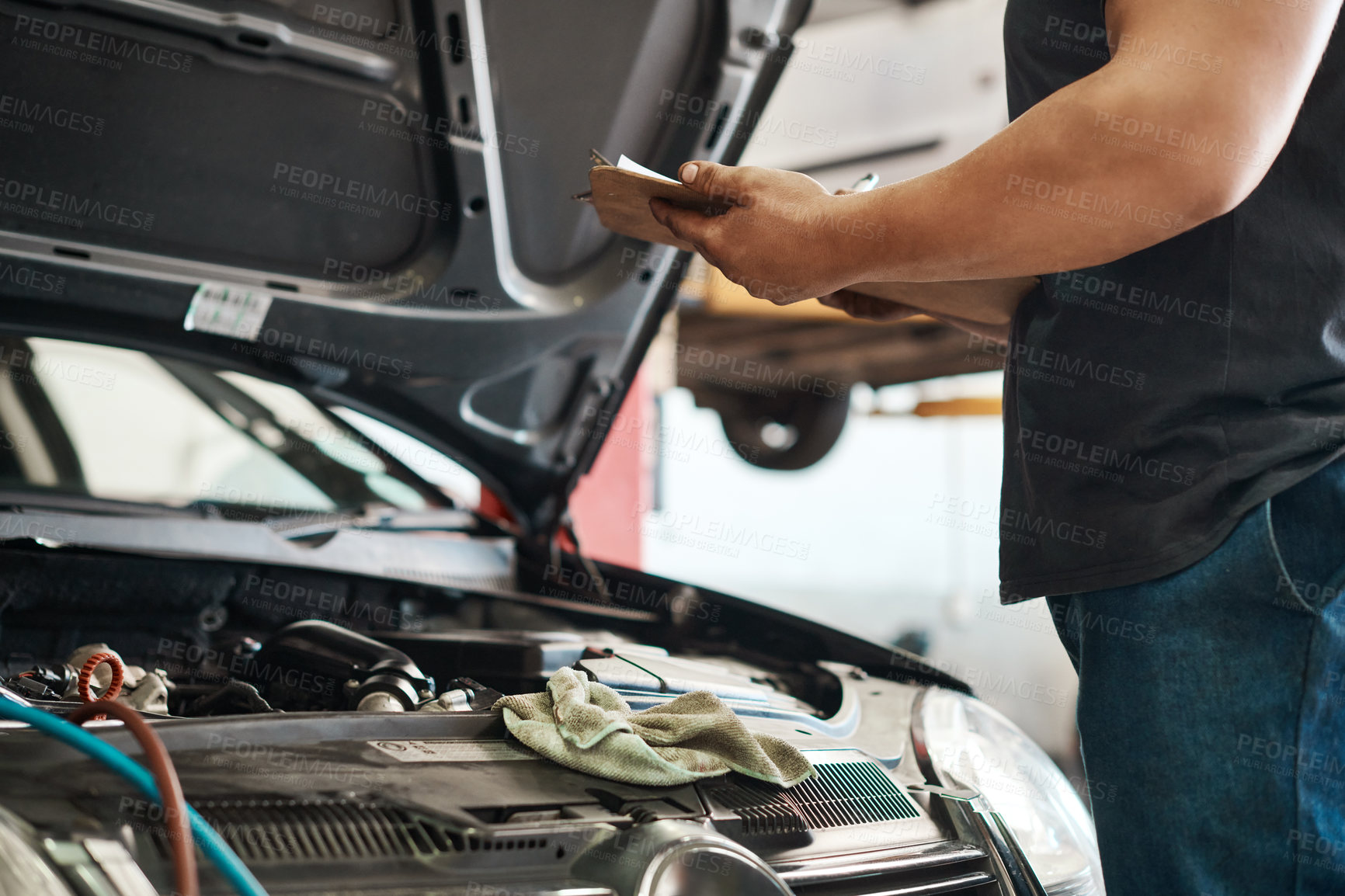 Buy stock photo Clipboard, hands and mechanic in workshop with car service, maintenance or auto insurance. Checklist, engine and man in garage for inspection, motor repair and quality assurance at small business.