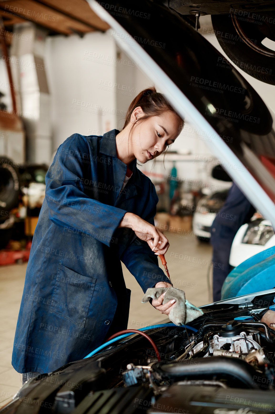 Buy stock photo Technician, woman and car engine in garage with dipstick auto repair, service or oil change. Mechanic, person and small business for vehicle maintenance with check, transport or industry at workshop