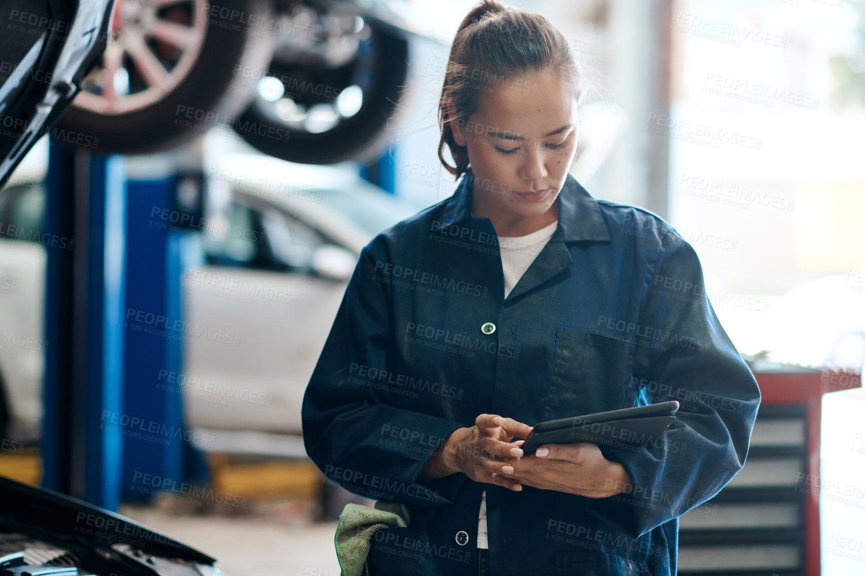 Buy stock photo Tablet, checklist and woman in garage with car service, maintenance or online motor insurance. Tech, engine and female mechanic in workshop on digital app for inspection, repair and quality assurance