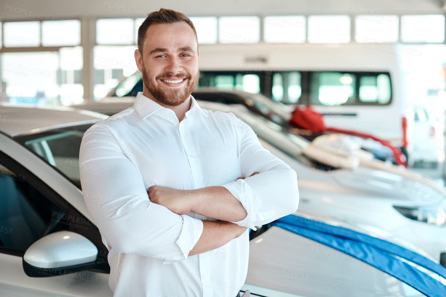 Buy stock photo Car dealership, portrait or happy man with arms crossed for vehicle, finance or confidence. Welcome, smile or proud salesman in showroom ready for business, transportation or consultant by automobile