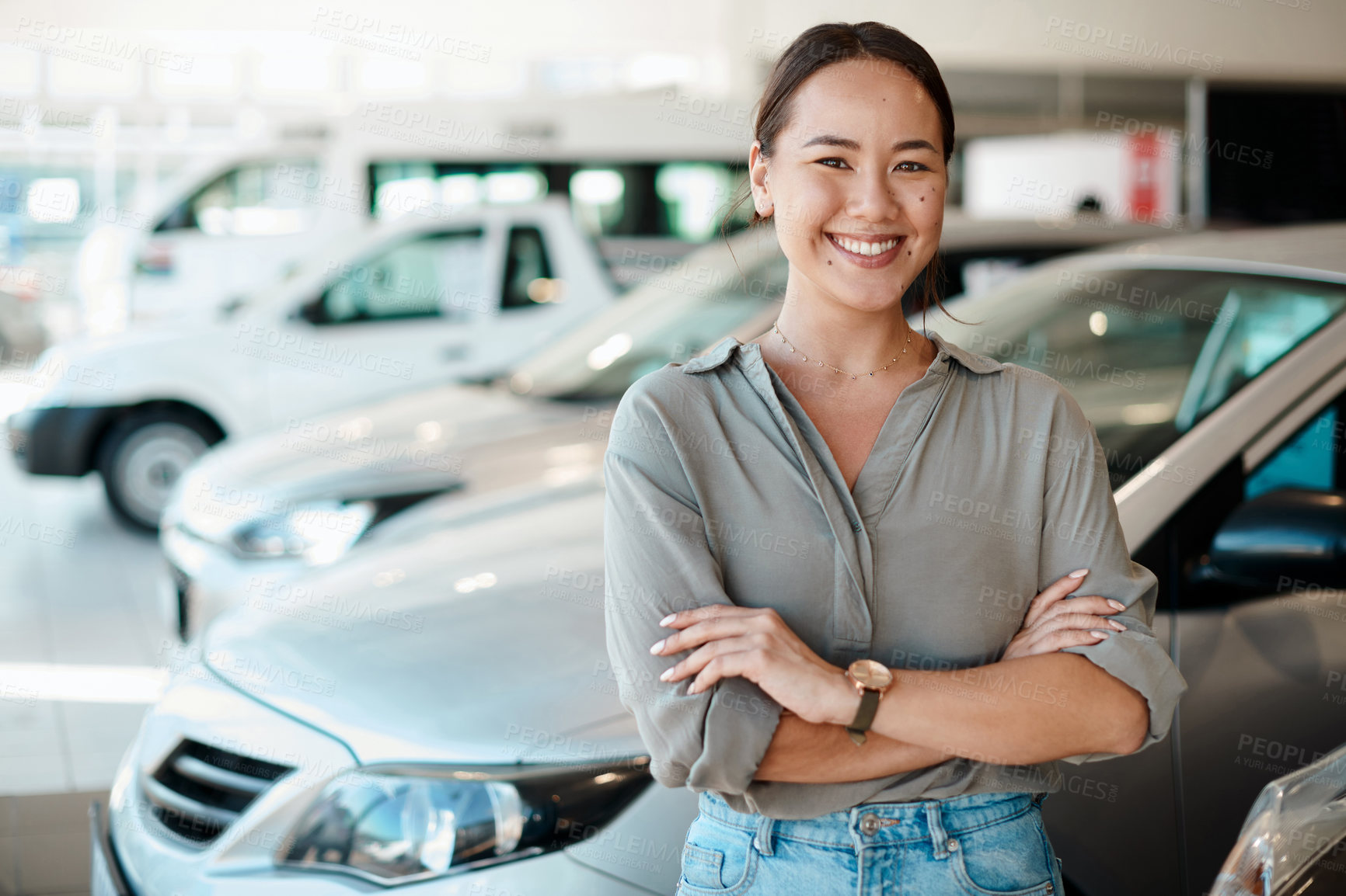 Buy stock photo Woman, portrait and happy at car dealership with sale, payment and purchase of new motor. Shopping, customer and arms crossed with pride from deal and investment of vehicle at showroom and store