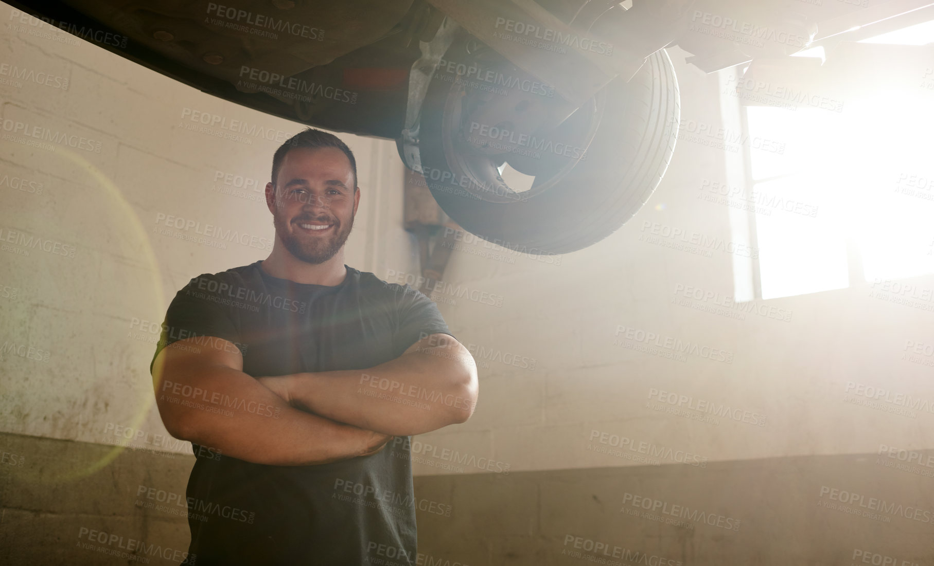 Buy stock photo Portrait, man and arms crossed as car mechanic in workshop with pride for career growth. Garage, confident and smile for startup or small business as engineer with repairs, service and maintenance