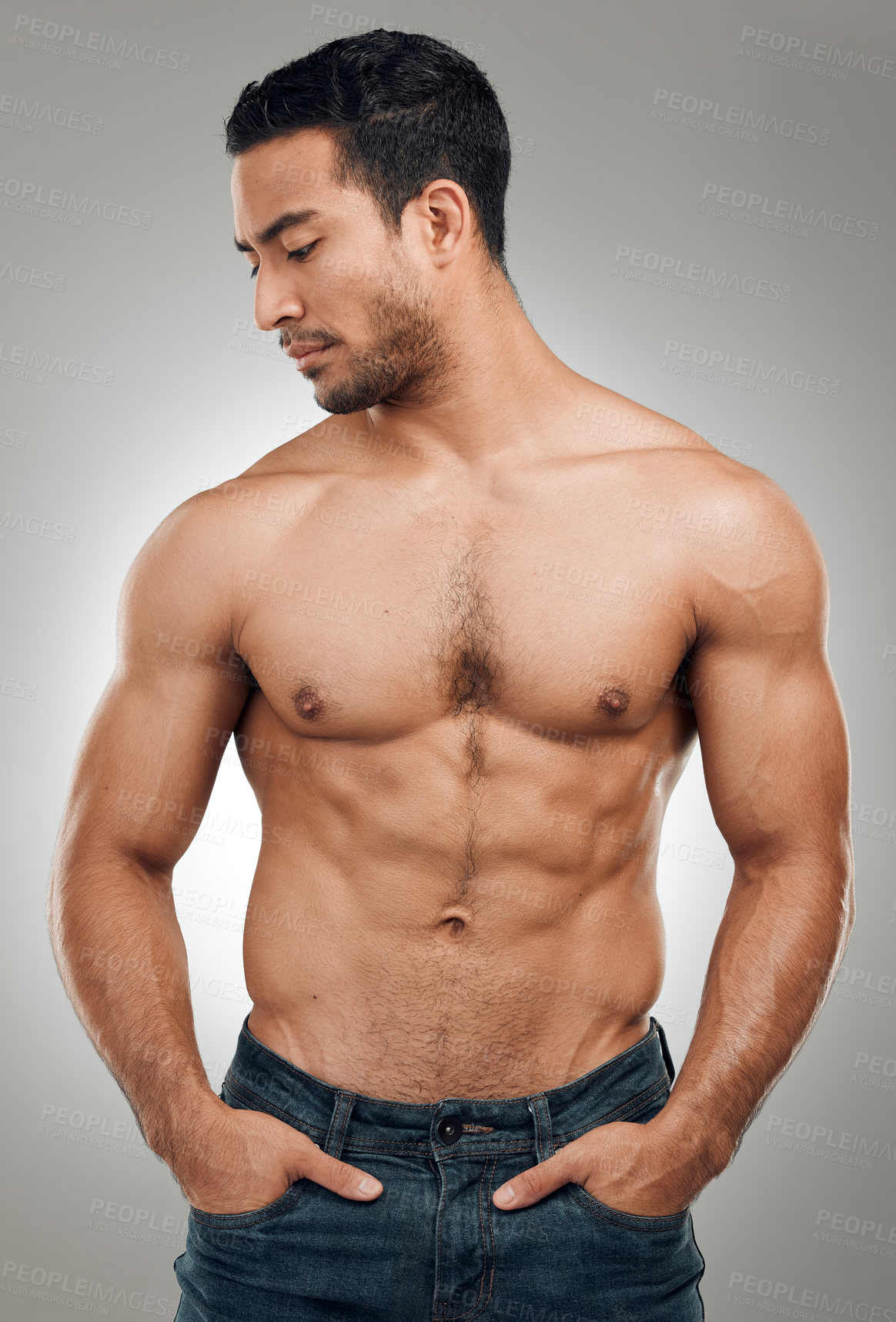 Buy stock photo Man, body and thinking in studio with abs or muscles, shirtless and grey background with model or bodybuilder. Jeans, strong chest and Asian male person on backdrop, confidence with six pack