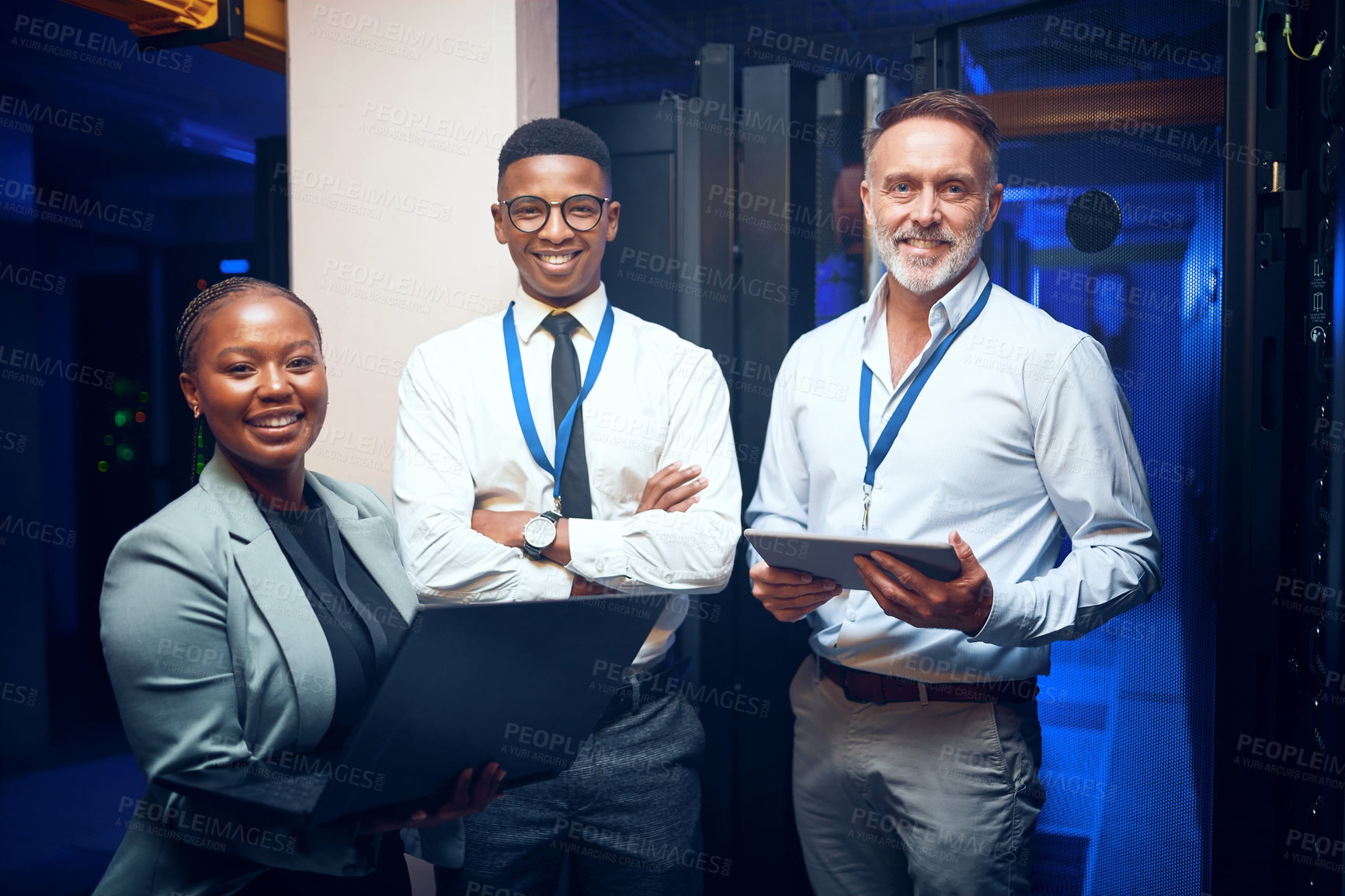 Buy stock photo Portrait of a group of technicians working together in a server room