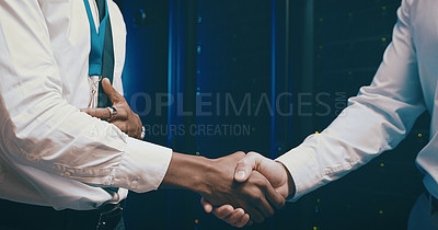Buy stock photo Closeup shot of two unrecognisable men shaking hands in a server room