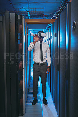 Buy stock photo Full length shot of a young IT specialist standing alone in the server room and wearing a virtual reality headset