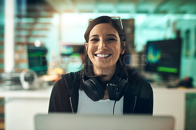 Buy stock photo Portrait of a cheerful young woman wearing a headset around her neck in a modern office