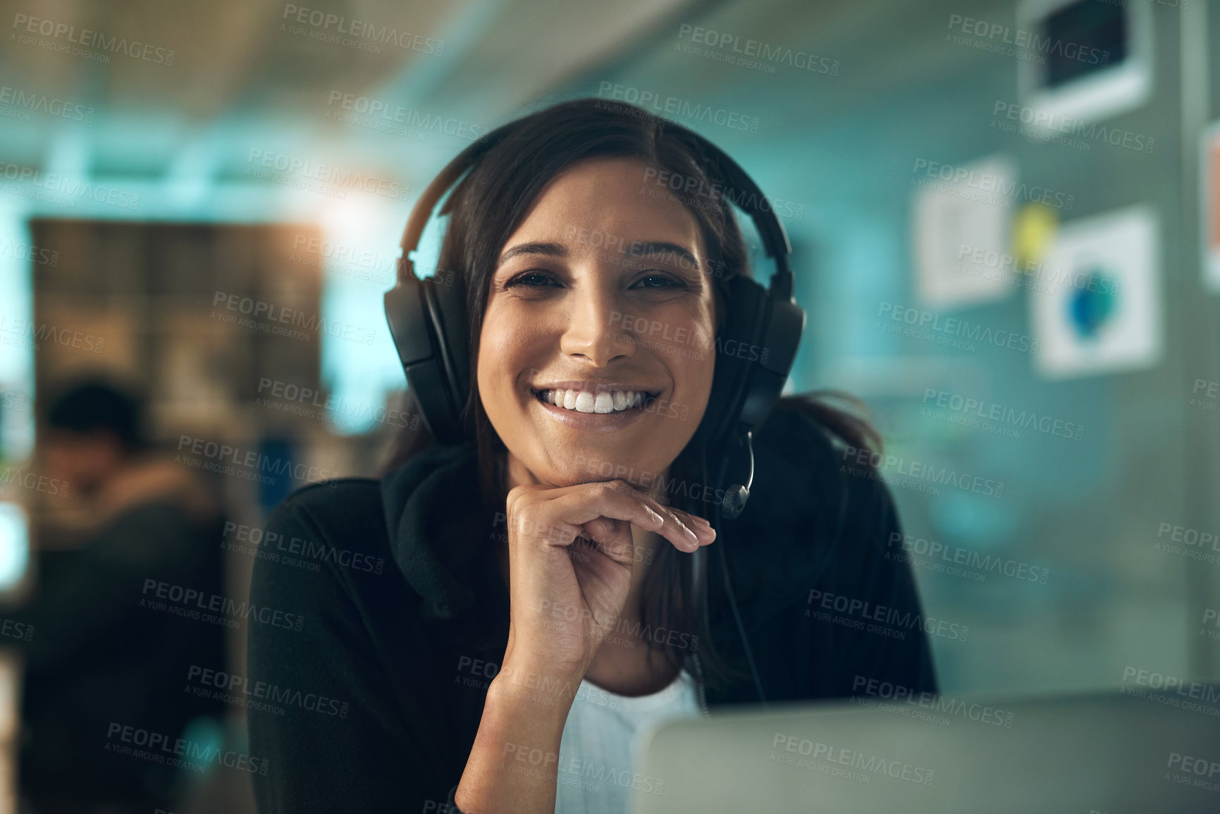 Buy stock photo Portrait of a young woman using a headset in a modern office