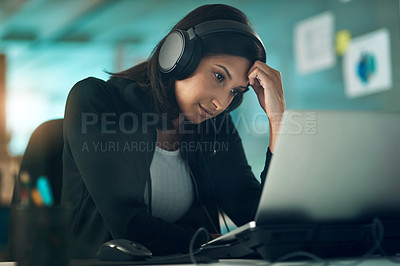 Buy stock photo Portrait of an exhausted young woman using a headset in a modern office