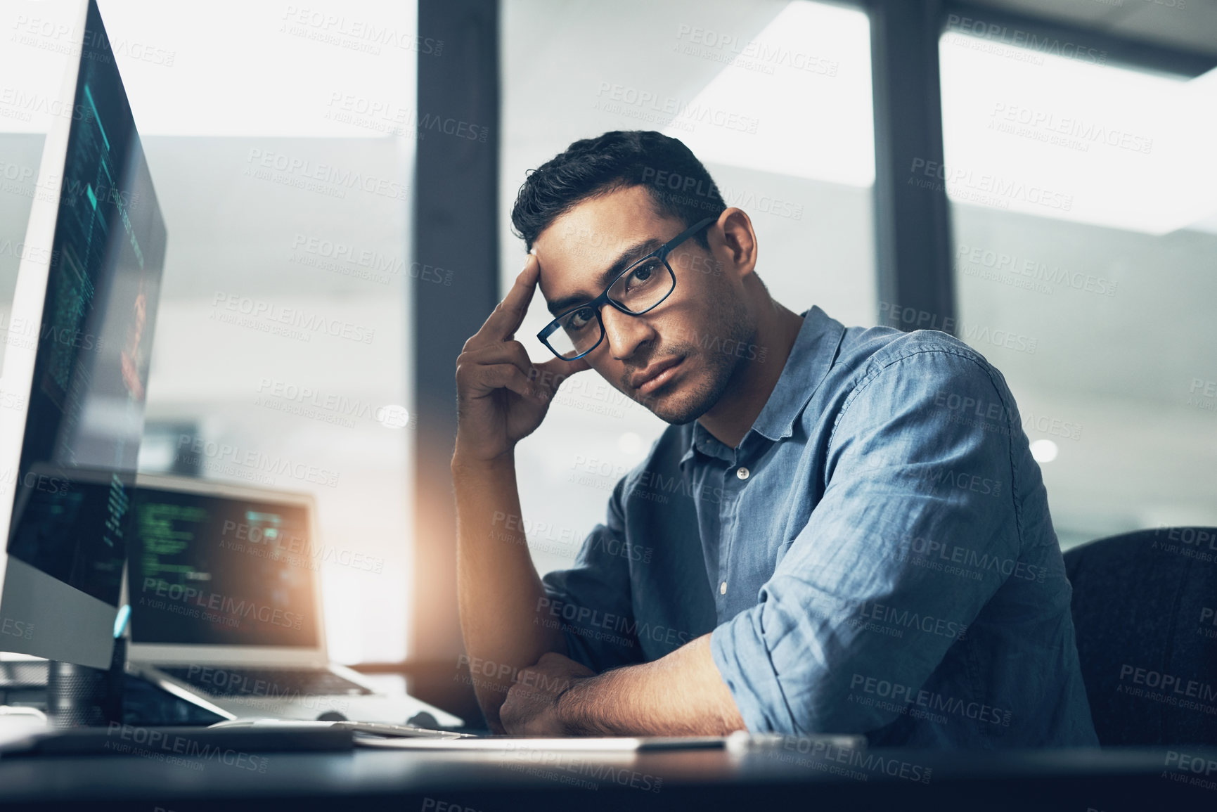 Buy stock photo Portrait of a man using a computer in a modern office