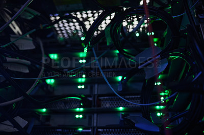 Buy stock photo Cropped shot of a large, dark and empty server room