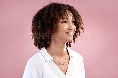 Buy stock photo Cropped shot of an attractive young woman looking thoughtful in studio against a pink background