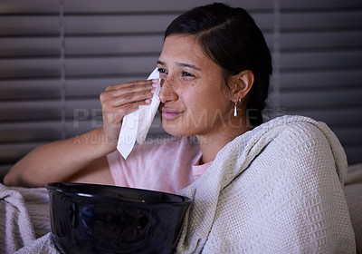 Buy stock photo Shot of a young woman crying while watching tv at home
