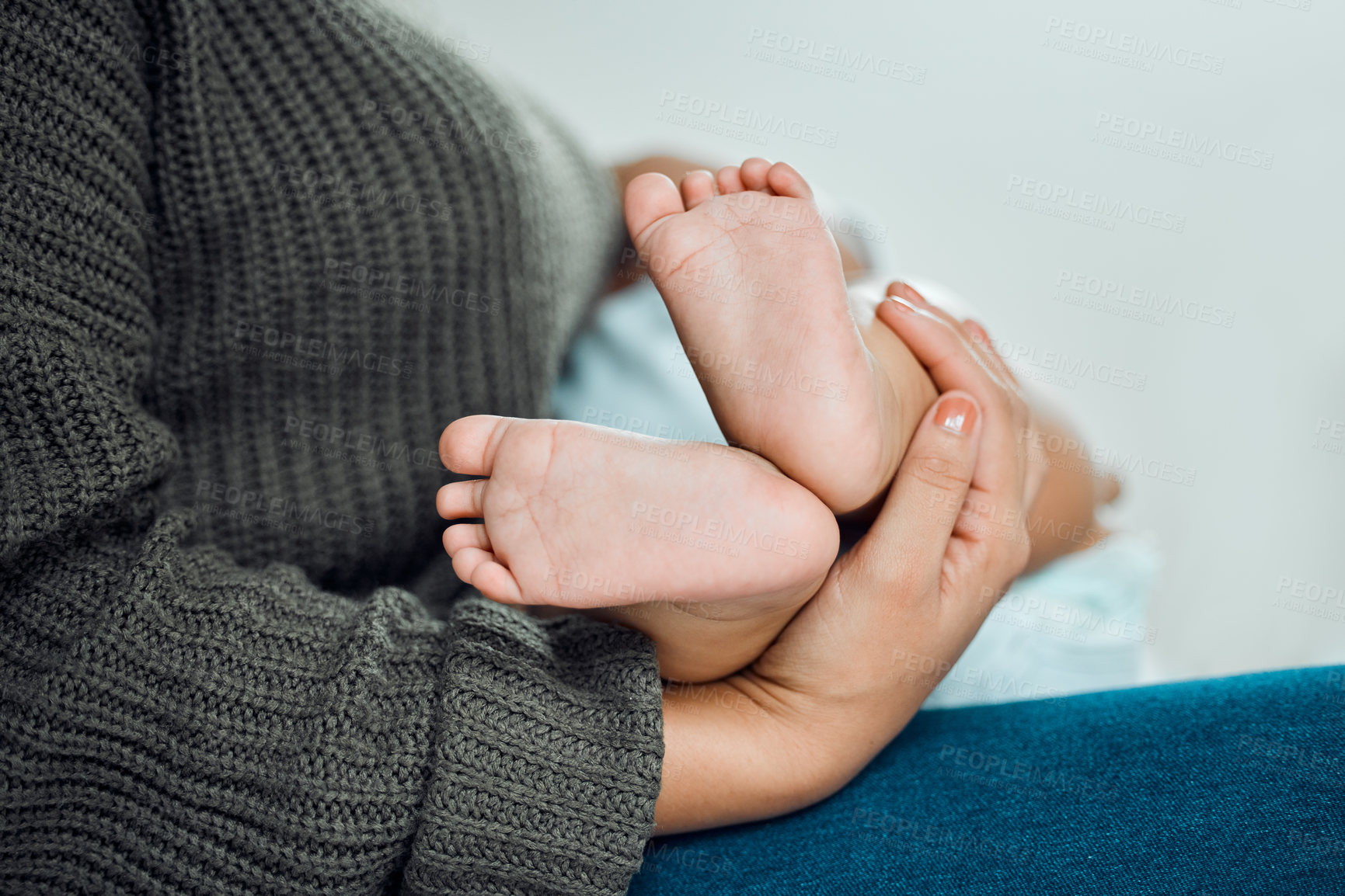 Buy stock photo Baby, hands and mother holding feet for growth, support and development in family home. Newborn, woman and wellness in bedroom for relax, security and together with love and care for child and mama 