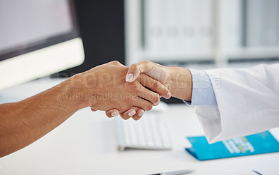 Buy stock photo Cropped shot of an unrecognizable doctor shaking hands with her patient during a consult in the clinic