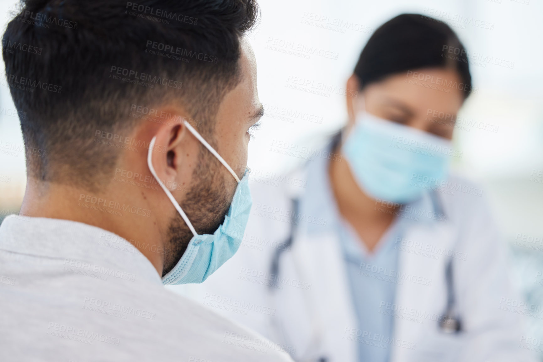 Buy stock photo Doctor, patient and face mask at clinic for protection with care, support and consultation. Female person, medical and healthcare employee for emergency with dedication in hospital for wellness