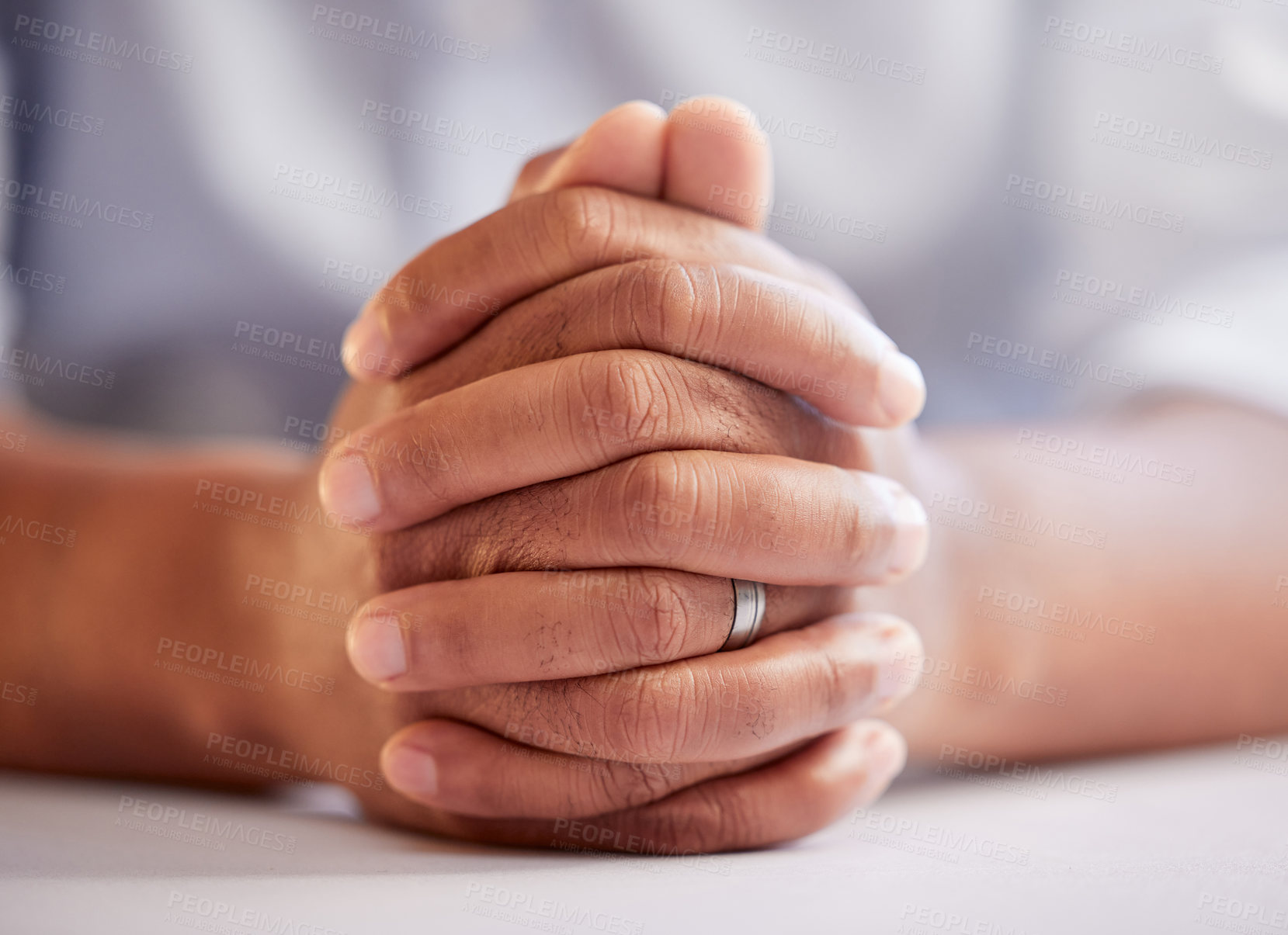 Buy stock photo Hands, prayer and closeup in office with faith, religion and connection with God for spiritual guide in career. Person, worship and mindfulness with gratitude, trust and peace at desk in workplace