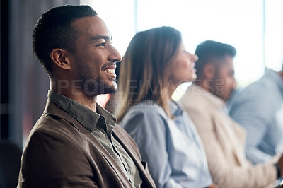 Buy stock photo Shot of a young businessman during a conference in a modern office