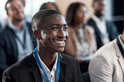 Buy stock photo Shot of a young businessman during a conference in a modern office