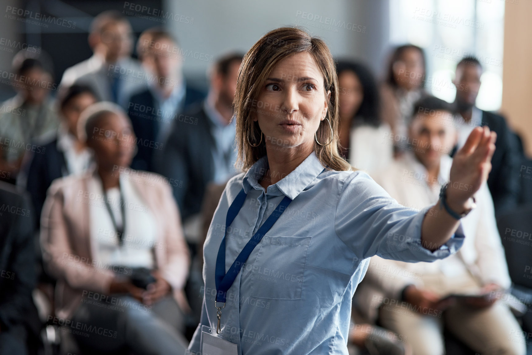 Buy stock photo Shot of a businesswoman delivering a presentation at a conference