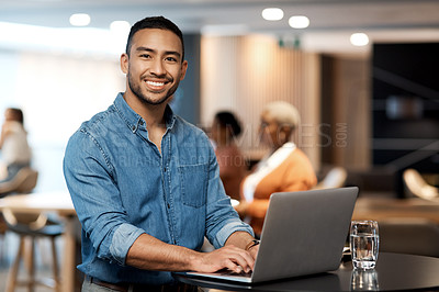 Buy stock photo Shot of a young businessman using a laptop at a conference