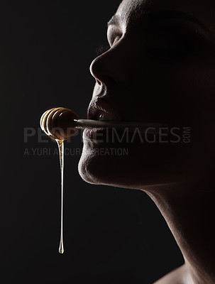 Buy stock photo Studio shot of a woman woman posing against a black background