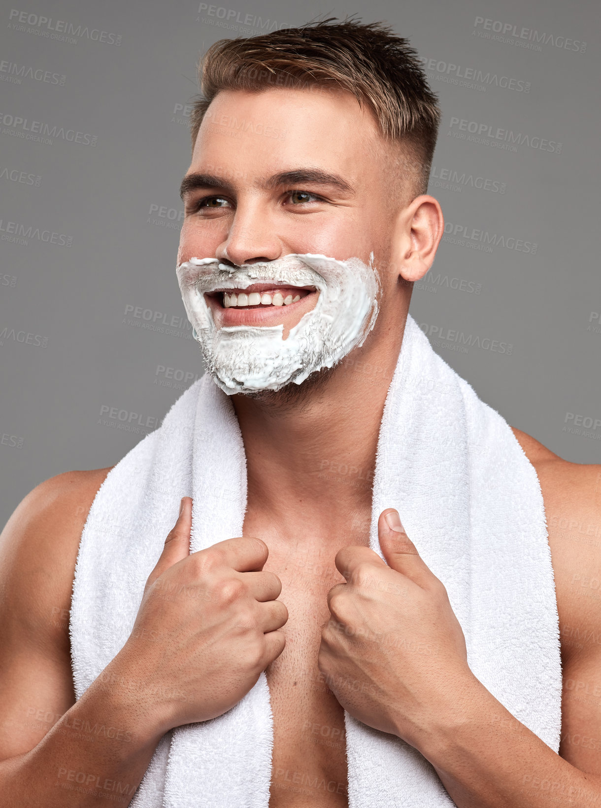 Buy stock photo Studio shot of a handsome young man with shaving foam on his beard against a grey background