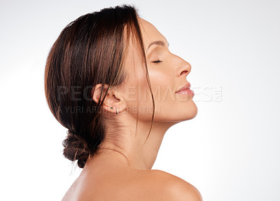 Buy stock photo Shot of an attractive young woman posing alone in the studio