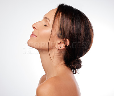 Buy stock photo Shot of an attractive young woman posing alone in the studio