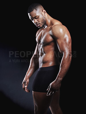 Buy stock photo Black man, underwear and serious fitness in studio, strong arms and muscle on dark background. Male person, confidence and athlete for power or healthy body, bodybuilder and stomach for wellness