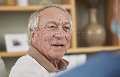 Buy stock photo Shot of an elderly man having a checkup with an unrecognizable nurse at home