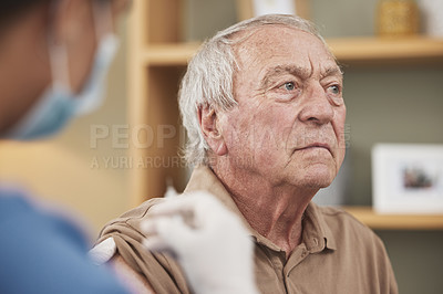 Buy stock photo Shot of an unrecognizable nurse giving a patient the vaccine at home