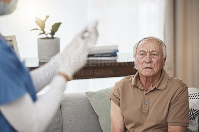 Buy stock photo Shot of an unrecognizable nurse giving a patient the vaccine at home