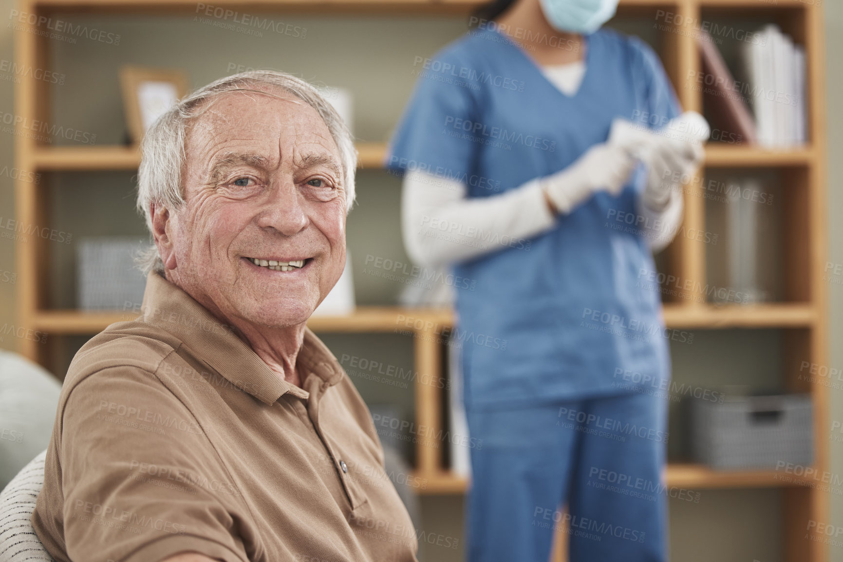 Buy stock photo Shot of an unrecognizable female nurse having a checkup with an elderly patient at home