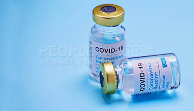 Buy stock photo Studio shot of vaccine tubes against a blue background