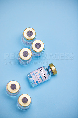 Buy stock photo Studio shot of vaccine tubes against a blue background