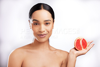 Buy stock photo African woman, studio and portrait with grapefruit for beauty, natural cosmetics for facial. Female person, white background or makeup with smile for sustainable skincare, detox wellness or aesthetic