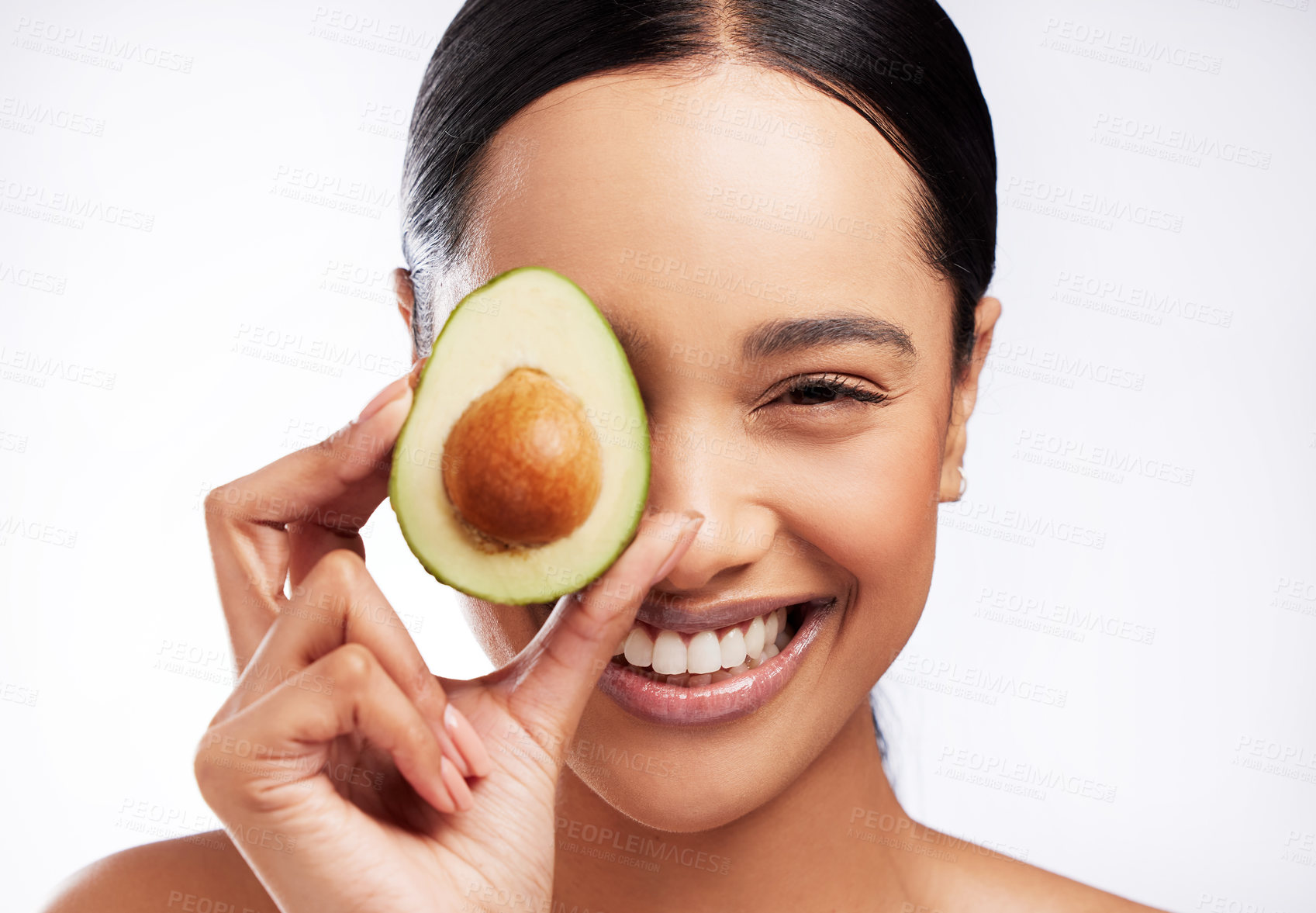 Buy stock photo Portrait, avocado and woman with smile in studio for skincare, wellness and nutrition. Model girl, glow and vitamin c for vegan and organic products for health and detox by white background.