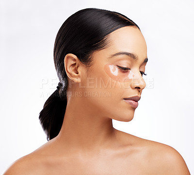 Buy stock photo Skincare, eye patch and treatment for woman, studio and  cosmetics for beauty, vitamin c and hydration. White background, person and girl with healthy skin, routine and grooming with dermatology